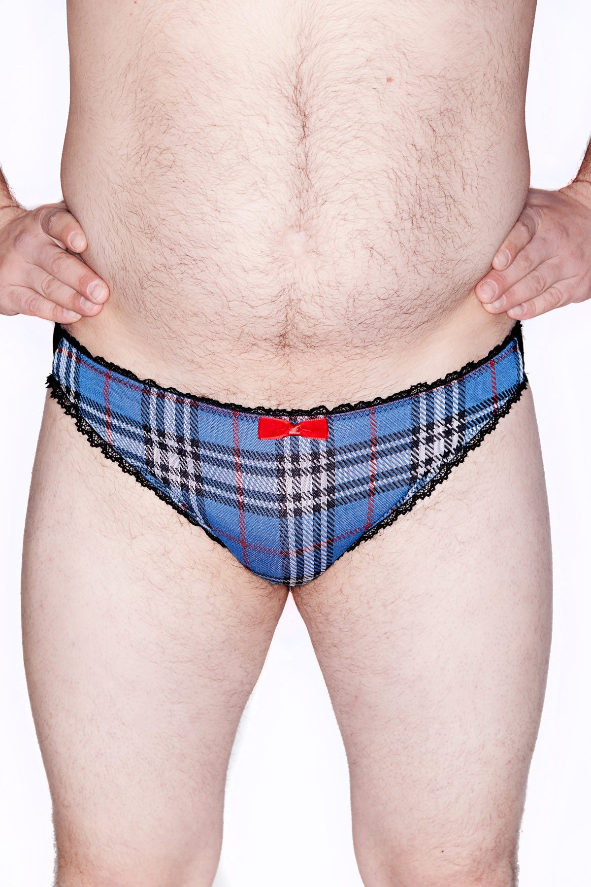 Mens Blue Plaid Lace back Brief. Crafted from soft ponte plaid and cotton with a luxurious rose lace back for a timeless, sophisticated look. Detailing includes ruffle elastic and velvet center bow. 