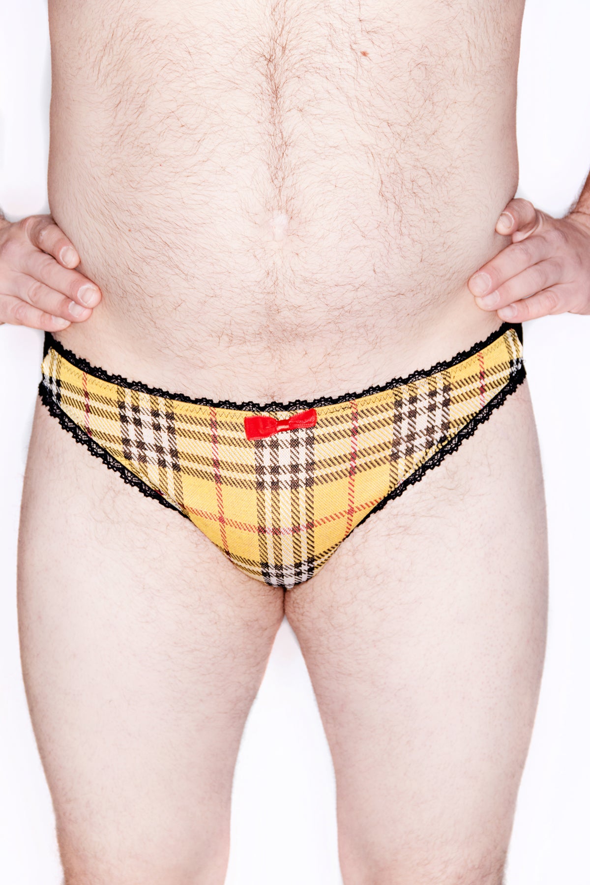  Tartan Brief with rose lace backs Look sharp in this high-quality Mens Blue Plaid Lace back Brief. Crafted from soft ponte plaid and cotton with a luxurious rose lace back for a timeless, sophisticated look. Detailing includes ruffle elastic and velvet center bow. 